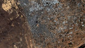 Images show crowds of people gathering at the Rafah crossing between Gaza and Egypt