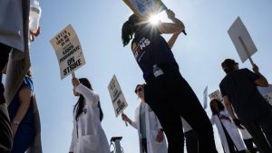 Kaiser Permanente workers are on strike. Here’s what makes it such a unique health care company