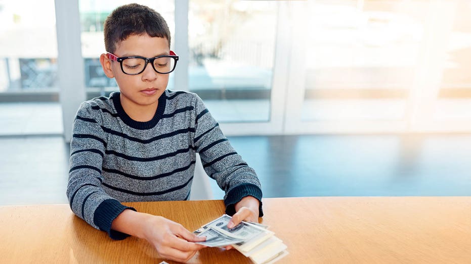 little goy counting money