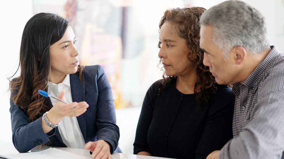 couple meeting with a financial adviser