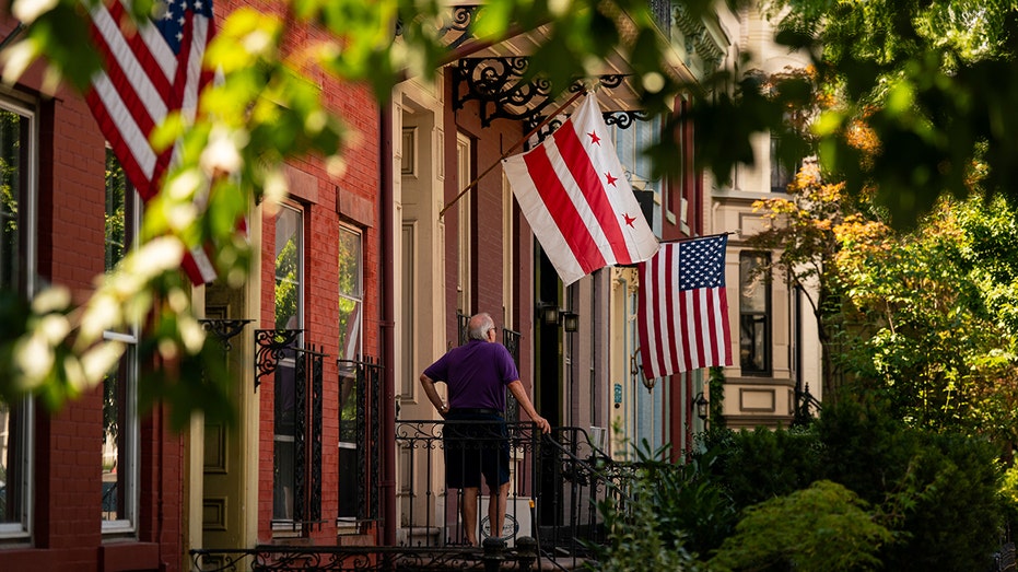 The District of Columbia and US flags outside a home in the Capitol Hill neighborhood of Washington, DC,